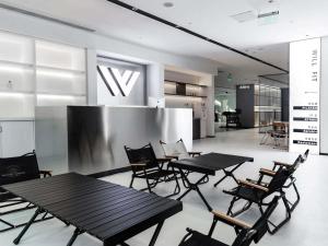 a group of tables and chairs in a room at Novotel Nanjing Central in Nanjing