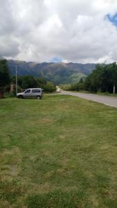 a limousine parked on the side of a road at Departamento Fede 1 in Carpintería