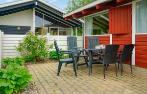 a table and chairs sitting on a patio at Golfparken in Aabenraa +13 photos