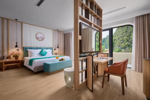 a hotel room with a bed and a desk at Heritage Charm Hotel Trang An in Ninh Binh +45 photos