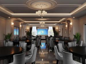 a conference room with tables and chairs and a projection screen at Hai Dang Hotel Ha Tinh in Hà Tĩnh +18 photos