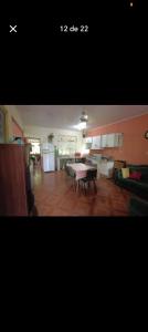 a living room with a table and a couch at Quinta los almendros in Jabillos