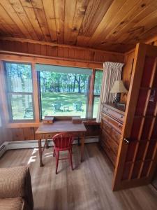 a dining room with a table and a window at Black Hawk in Mercer
