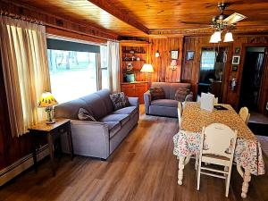 a living room with a couch and a table at Black Hawk in Mercer