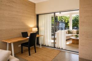a room with a desk with a laptop on it at Fishers Villa - Crescent Head in Crescent Head