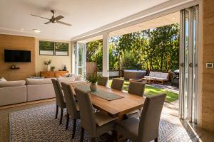 a dining room with a table and chairs at Fishers Villa - Crescent Head in Crescent Head