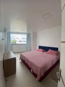 a bedroom with a large bed and a window at Vista mar nascente in São Luís +21 photos