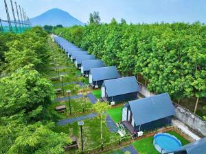 an overhead view of a row of trucks in a forest at Mekong Hotel in Tây Ninh