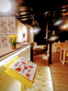 a book sitting on a table in a restaurant at Tentrem Bungalow in Labuan Bajo