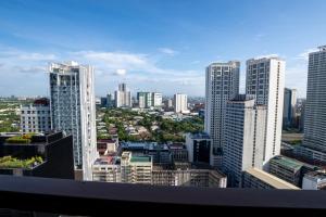 a view of a city with tall buildings at KL Tower Luxury Boutique Hotel Studio Fast WiFi Resort Swimming Pool Sauna & Gym in Manila
