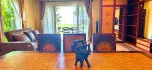 a figurine on a table in a living room at Luxury Beachfront SeaView Apartment in Ko Chang +25 photos