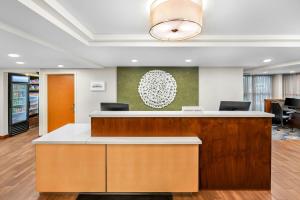 an office with a reception desk in a lobby at Fairfield Inn Boston Woburn in Woburn