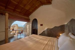 a bedroom with a bed and a table in a room at Ibala Hotel & Spa in Nha Trang +56 photos