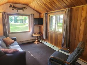 a living room with a couch and a window at Pine Haven in Mercer