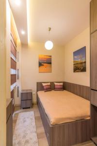 Ένα ή περισσότερα κρεβάτια σε δωμάτιο στο 1A Moment Apartment