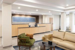 a lobby with a couch and a waiting room at Fairfield Inn & Suites – Buffalo Airport in Cheektowaga