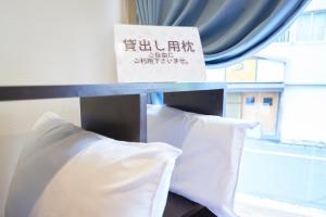 Uma cama ou camas num quarto em Select Inn Shimada Ekimae