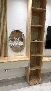 a circular mirror in a room with a bed at Allaoua in Stamboul +6 photos