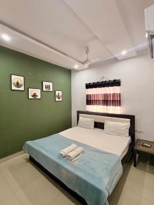 a bedroom with a bed with two towels on it at The capital hotel in Visakhapatnam