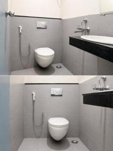 a bathroom with a toilet and a sink at The capital hotel in Visakhapatnam