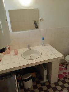 a bathroom with a sink and a mirror at Domček v Turnej in Trenčianska Turná +21 photos