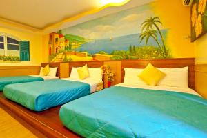 Ένα ή περισσότερα κρεβάτια σε δωμάτιο στο Bashi Channel Vacation B&B