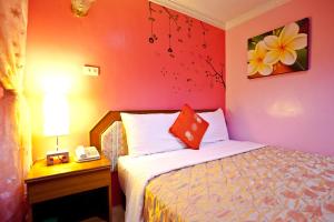 Krevet ili kreveti u jedinici u okviru objekta Bashi Channel Vacation B&B