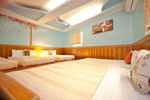 Krevet ili kreveti u jedinici u okviru objekta Bashi Channel Vacation B&B