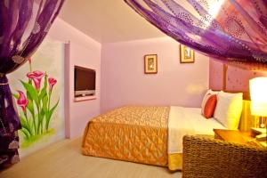 Krevet ili kreveti u jedinici u okviru objekta Bashi Channel Vacation B&B