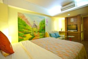 เตียงในห้องที่ Bashi Channel Vacation B&B