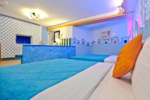 Krevet ili kreveti u jedinici u okviru objekta Bashi Channel Vacation B&B