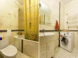 a bathroom with a toilet sink and a washing machine at Apartment in center in Ivano-Frankivsʼk