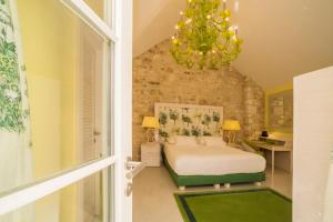 Voodi või voodid majutusasutuse Hotel Lemongarden - Adults Only toas