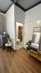 a room with a bathroom with a toilet and a mirror at Malina Guesthouse in Ko Phangan +111 photos