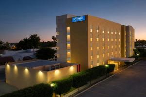 a building with a sign on top of it at City Express by Marriott Ciudad Obregon in Ciudad Obregón
