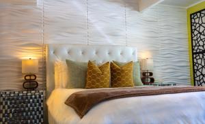 a bedroom with a large white bed with two lamps at Private Luxury Retreat with Kitchen Near SF & Wine Country in San Rafael