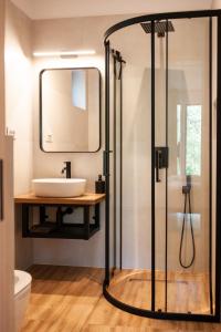 a bathroom with a sink and a mirror at Bran Villa - A-frame Orchard Hygge in Bran +61 photos