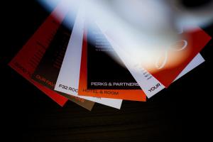 a bunch of tickets are hanging from a pole at ALPAMI Boutique Glockenbach in Munich +56 photos
