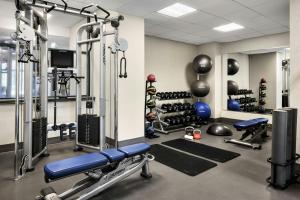 a gym with treadmills and weights at Chicago Marriott Suites Deerfield in Deerfield
