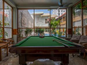 a billiard room with a pool table in it at Kaani Village & Spa - Stay 3 Nights and Save 20 Percent on Spa and 10 Percent on Dining Until 31 October 2026 in Maafushi