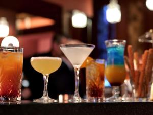a group of different types of drinks on a table at Mercure Moulins Centre Hôtel de Paris in Moulins
