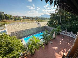 a view of a swimming pool from a house at NamKhan Riverside in Luang Prabang