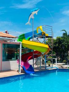 a water slide in a pool at a resort at Home Hakim in Cha Am