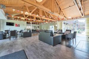 a lobby with couches and chairs in a building at Jubilee Bungalow Pet Friendly Sleeps 3 in Penrith