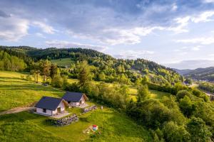 an aerial view of a house in a green field at Wyborny Zakątek in Powrożnik