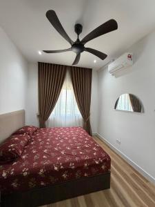 a bedroom with a bed and a ceiling fan at Sufi Islamic Homestay for Islamic only in Nilai +11 photos