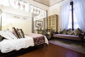 Postel nebo postele na pokoji v ubytování Hotel Burchianti