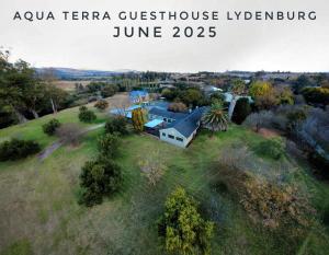 an aerial view of a house on a field at Aqua Terra Guest House in Lydenburg