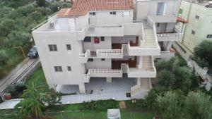 an aerial view of a white house at olivensun apartment 7 in Gythio +5 photos