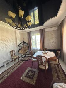 a room with a table and chairs and a dining room at mado house in Chakvi +10 photos